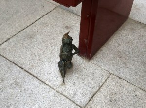 One of the little brass gnomes found throughout the city of Wroclaw, Poland