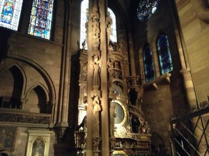 Strasbourg Cathedral interior - The Pillar of Angels, forefront; The Astronomical Clock, behind