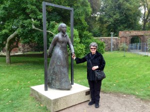 Kathy holding the "hand" of Katharina Von Bora in the garden at Luther Haus, Wittenberg, Germany