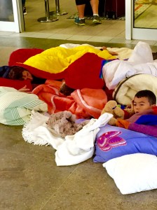 A refugee family asleep on the floor of the train station in the border town of Freilassing, Germany
